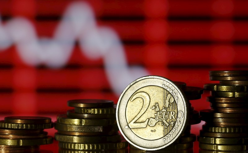 Euro coins are seen in front of a displayed stock graph in this photo illustration taken in Zenica, Bosnia and Herzegovina, June 30, 2015. Picture taken on June 30, 2015. REUTERS/Dado Ruvic